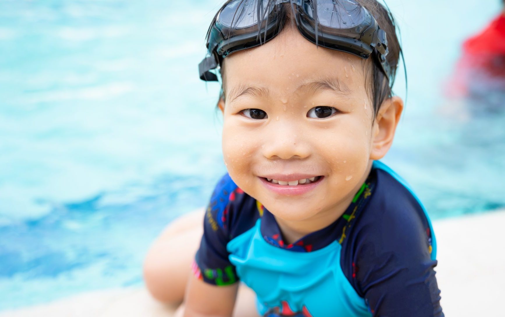Asian Boy Child enjoying in swimming pool
